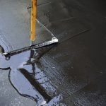 Man,Sealing,Asphalt,Driveway/sealcoating,Selective,Focus